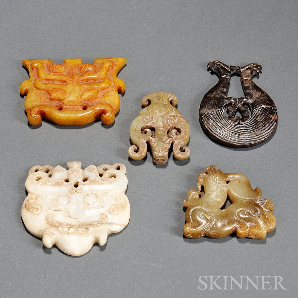 Appraisal: Five Stone Ornaments Asia all with mythical animal-inspired openwork designs