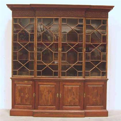 Appraisal: Mahogany stained pine breakfront cabinet th century H in W