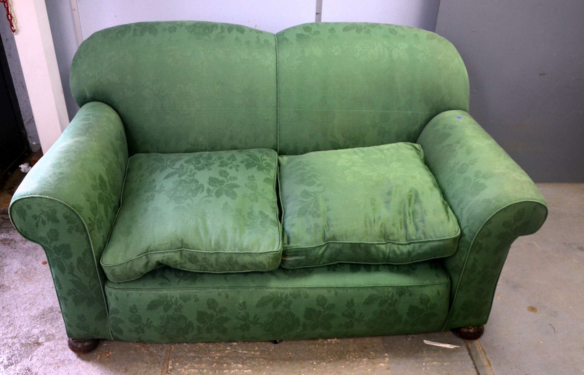 Appraisal: Green upholstered sofa