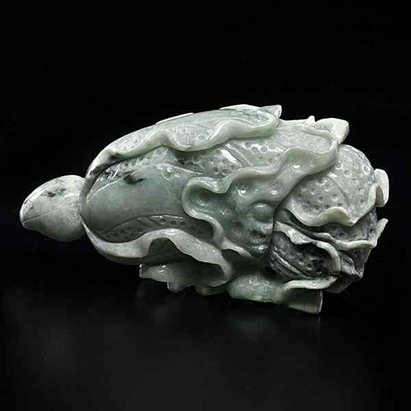 Appraisal: Chinese Jadeite Gourd Carving Chinese th century A jadeite carved