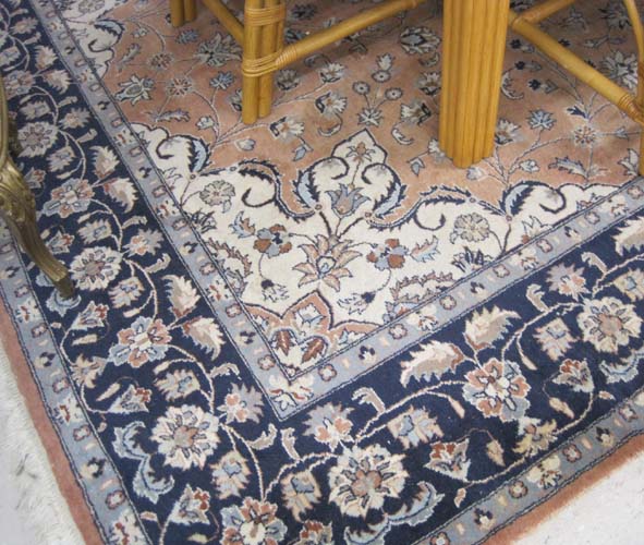 Appraisal: HAND KNOTTED ORIENTAL CARPET Pakistani-Persian floral and central floral medallion