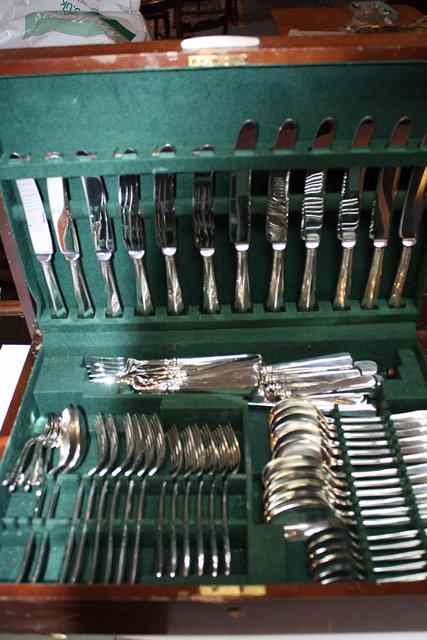 Appraisal: A CANTEEN OF SILVER PLATED CUTLERY with place settings for