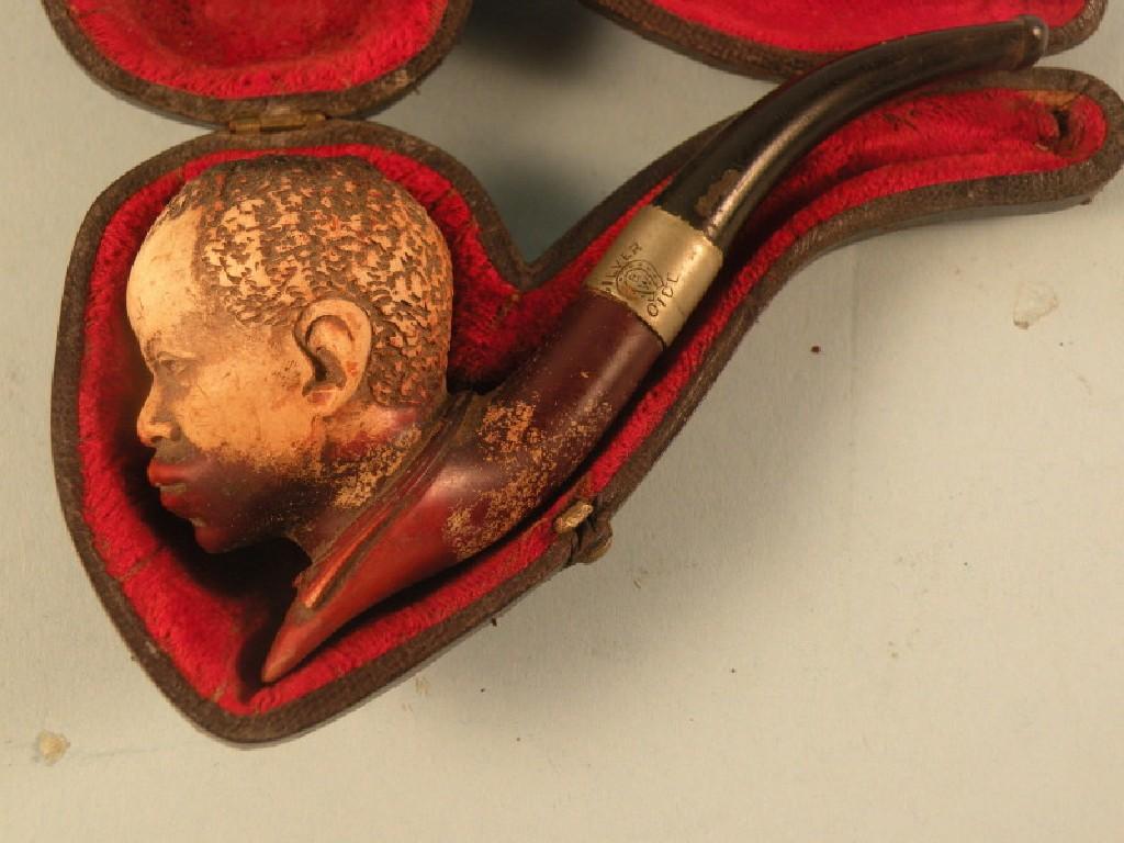 Appraisal: A carved Meerschaum pipe in the form of a Negro