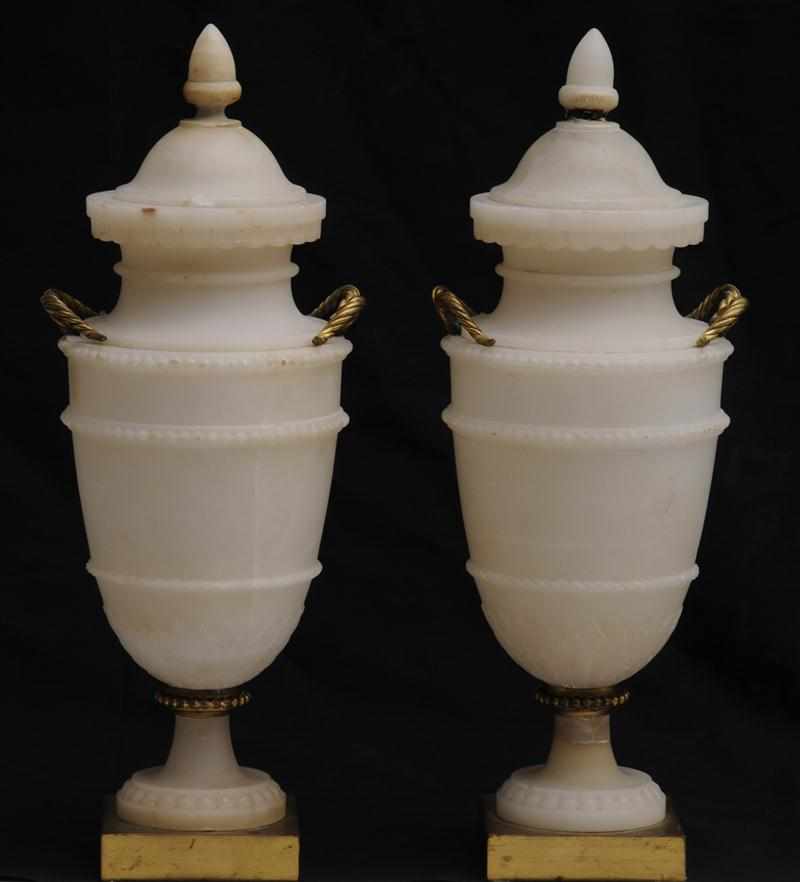 Appraisal: PAIR OF LOUIS XVI STYLE GILT-METAL MOUNTED ALABASTER URNS AND