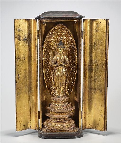 Appraisal: Japnese wood shrine with gilt Kannon and mandorla on multi-tiered