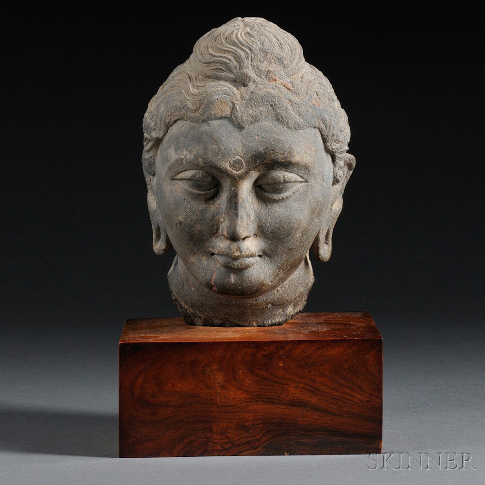 Appraisal: Gandharan-style Gray Schist Head of Buddha the serene face carved