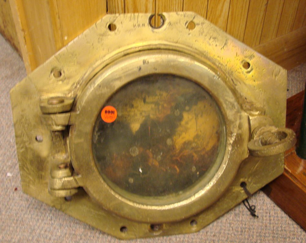 Appraisal: SHIP'S PORTHOLE Marked U S N Y Diameter of glass