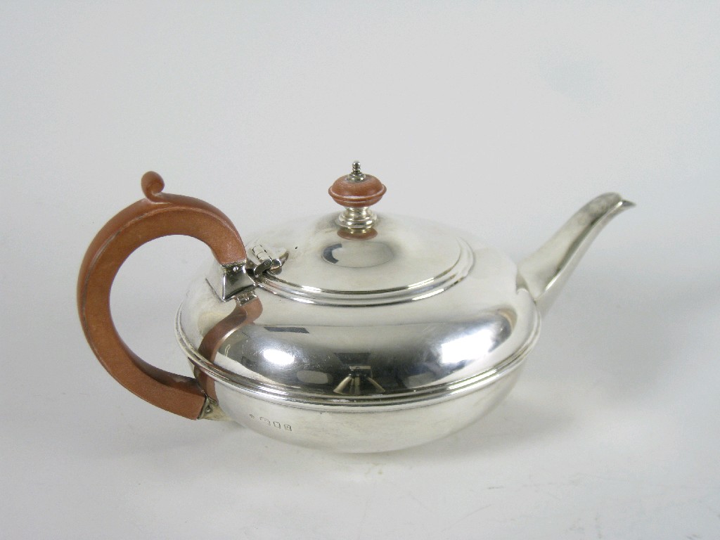 Appraisal: A George V Teapot of squat form with wooden finial