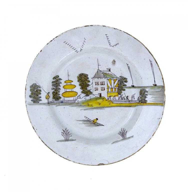 Appraisal: AN ENGLISH DELFTWARE POLYCHROME PLATE LIVERPOOL painted in manganese yellow