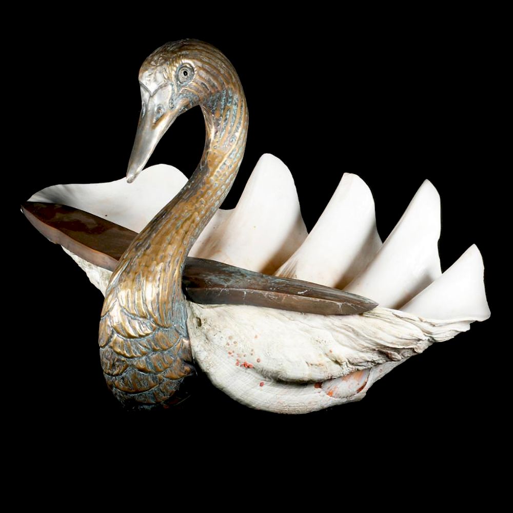 Appraisal: Giant clam shell swan A giant clam shell with a