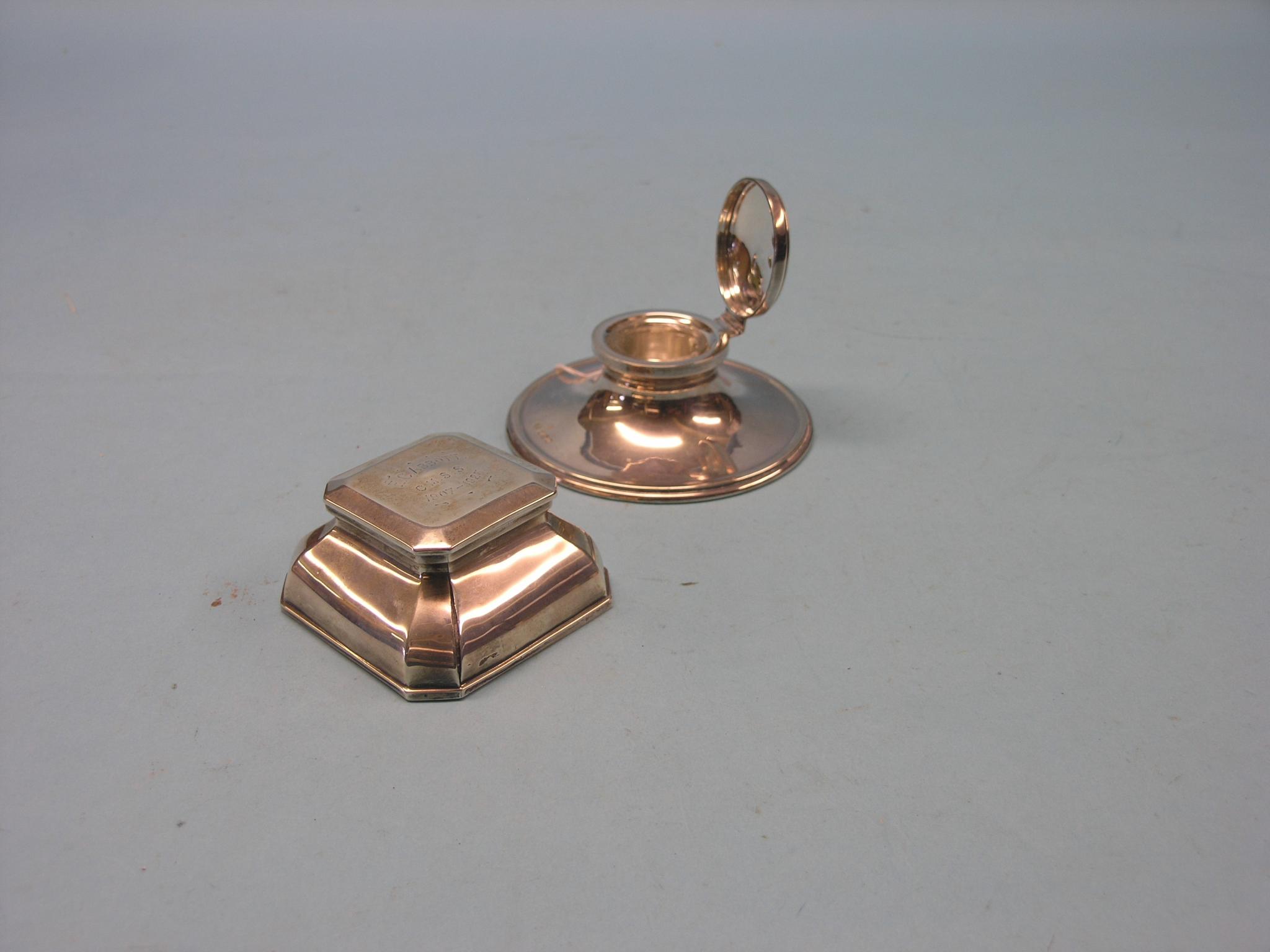 Appraisal: A silver capstan inkwell and another square-shape with canted corners