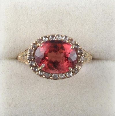 Appraisal: An oval shaped pink tourmaline and rose cut diamond cluster