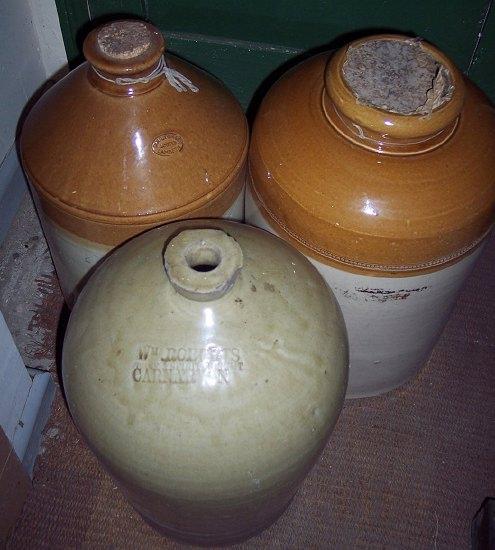 Appraisal: A large stoneware bottle stamped Wm Roberts Wine and Spirit