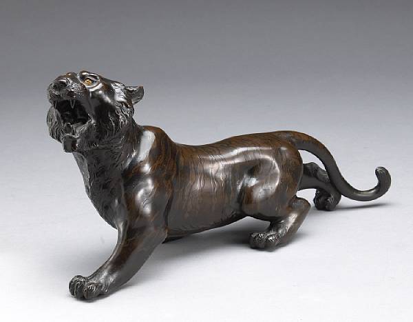 Appraisal: A bronze figure of a tiger Meiji Period The striding