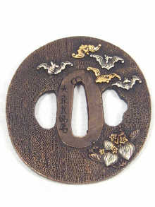 Appraisal: A Japanese bronze and silver tsuba