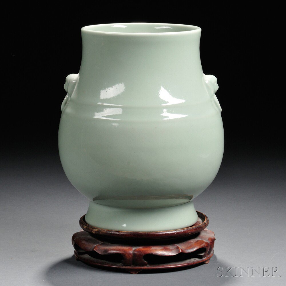 Appraisal: Celadon-glazed Vase China th century hu form with Buddhist lion-head