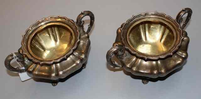 Appraisal: A PAIR OF ANGLO INDIAN SILVER TUREENS gourd shaped standing