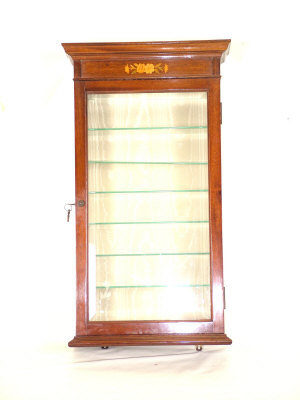 Appraisal: A small mahogany hanging display cabinet the moulded cornice above