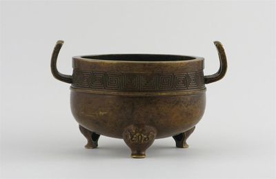 Appraisal: A Chinese bronze tripod censer cast with a key fret