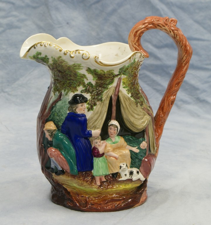 Appraisal: Staffordshire pottery pitcher with forest encampment scene hairline by handle