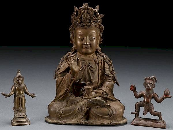 Appraisal: A GROUP OF THREE SINO-TIBETAN BRONZE DEITIES A GROUP OF