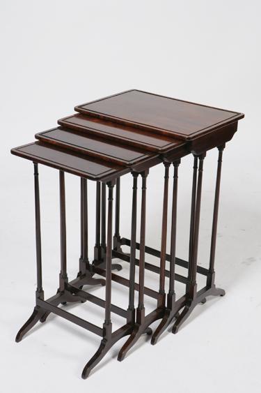 Appraisal: A NEST OF FOUR REGENCY ROSEWOOD QUARTETTO TABLES each with