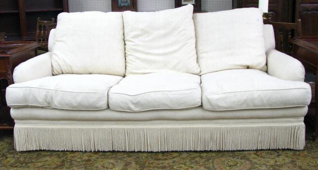 Appraisal: Cream Designer three cushion Sofa with Rope Fringe approximately ''