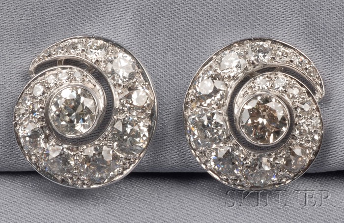 Appraisal: Platinum and Diamond Earclips each bezel-set with a full-cut diamond