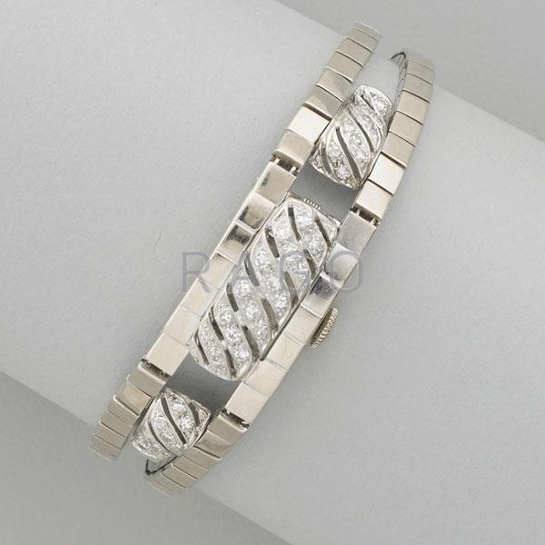 Appraisal: DIAMOND AND K GOLD DISCRETE BRACELET WATCH Condition Report