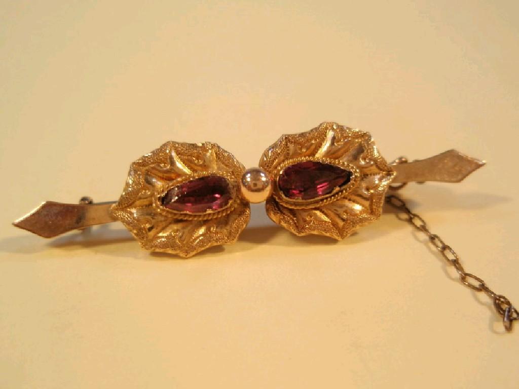 Appraisal: A Victorian garnet set bar brooch stamped ct