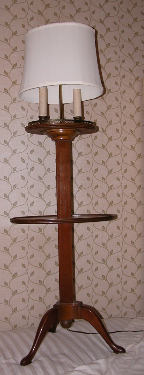 Appraisal: Artist Title Two-Tiered Mahogany table lamp with cabriole pad feet