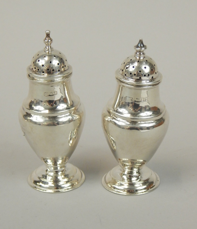 Appraisal: Two similar George VI silver baluster shaped pepper pots each