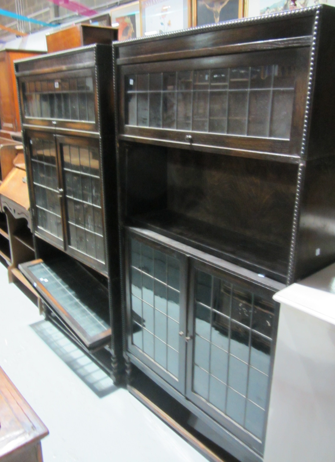 Appraisal: A pair of th century oak bookcases with leaded glass