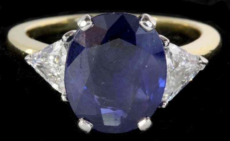 Appraisal: Platinum Gold and Sapphire and Diamond Ringcentering on one oval