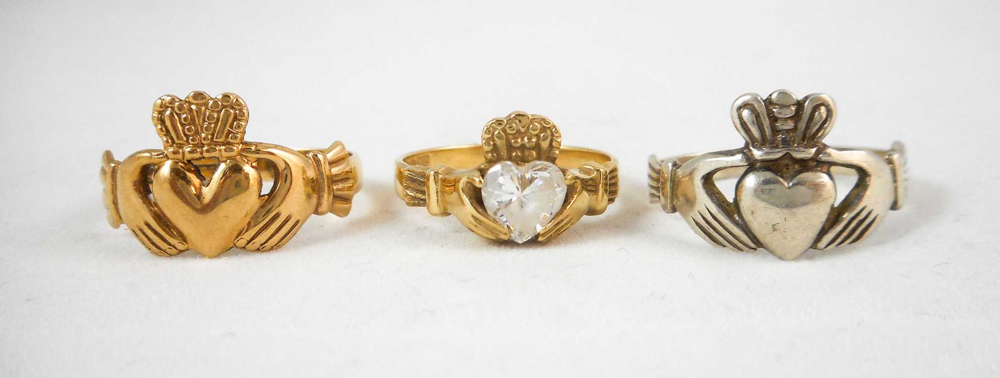 Appraisal: THREE IRISH CLADDAGH RINGS including a k yellow gold ring