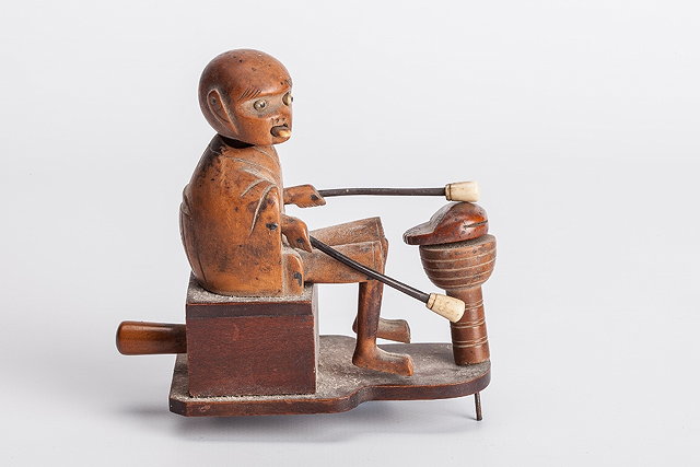 Appraisal: A JAPANESE CARVED WOODEN TOY in the form of a