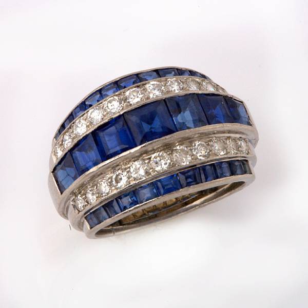 Appraisal: A sapphire and diamond band set with square-cut sapphires and