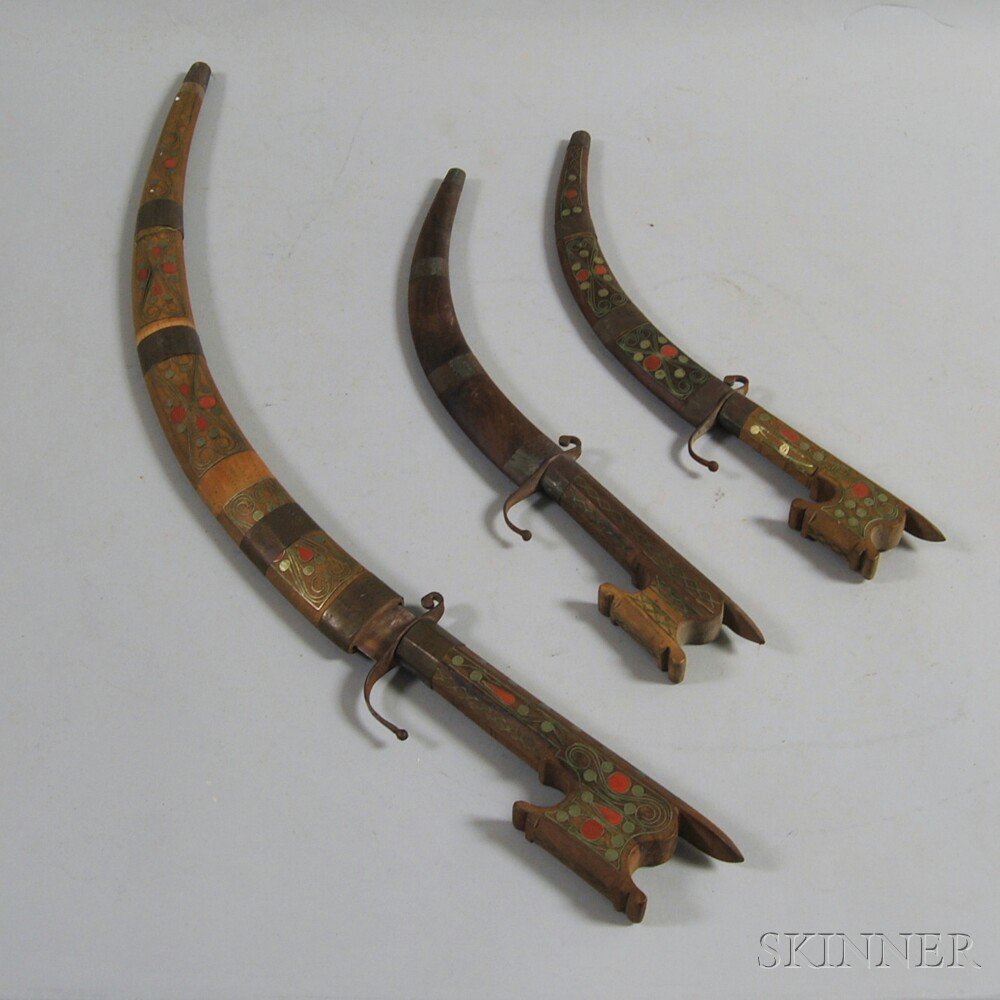 Appraisal: Three Carved and Inlaid Knives the scabbards and handles with