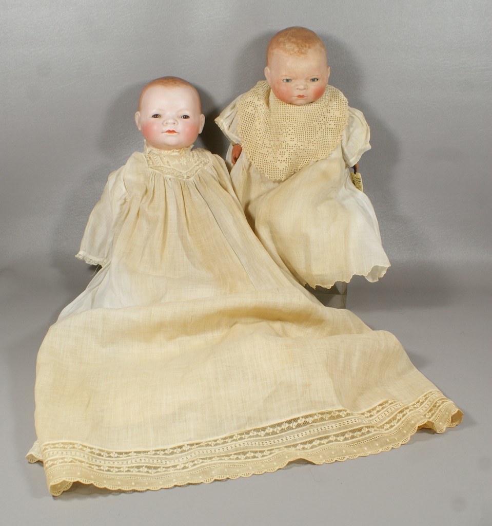 Appraisal: Bisque Head Bye-Lo Dolls with cloth bodies larger doll has