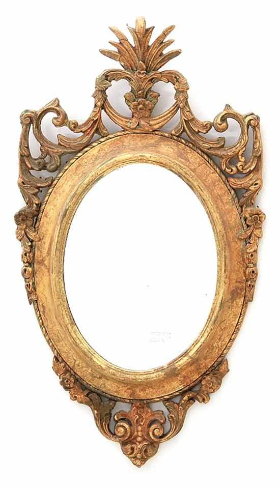 Appraisal: Chippendale style giltwood mirror rocaille finial cresting oval mirrorplate encompassed