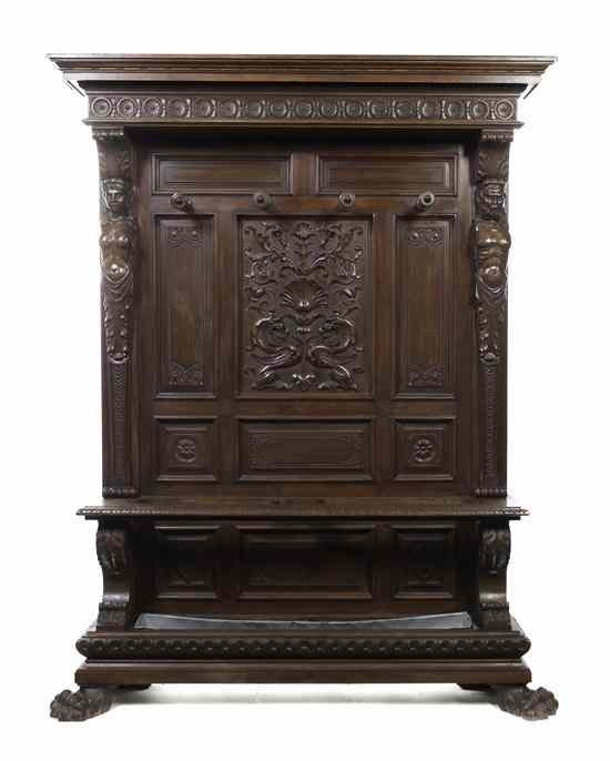 Appraisal: A Renaissance Revival Carved Walnut Hall Tree en suite with