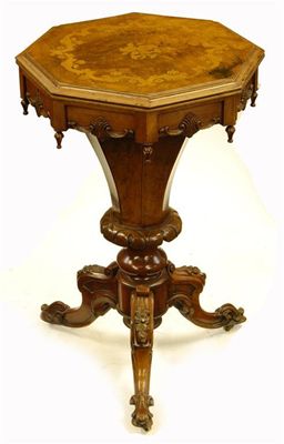 Appraisal: A Victorian walnut and marquetry work table the hinged top