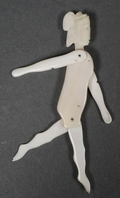 Appraisal: Figural Japanese woman with hinged limbs each designed to be