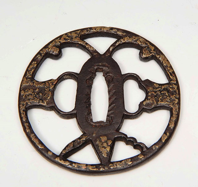 Appraisal: A JAPANESE METAL TSUBA with gilded decoration cm diameter