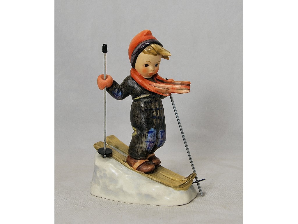 Appraisal: Hummell skier with metal ski poles cm high