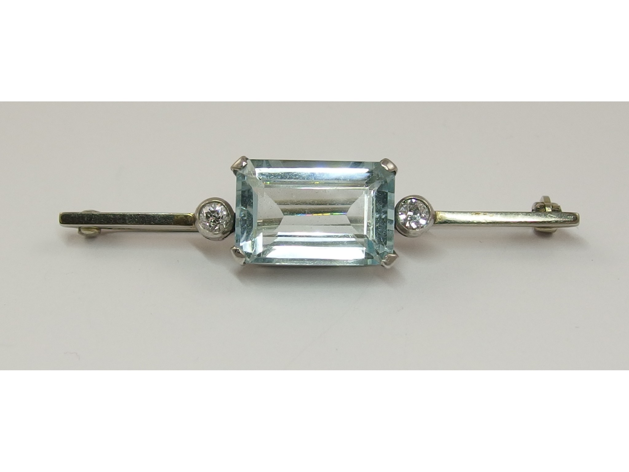 Appraisal: An aquamarine and diamond bar broochthe central aquamarine is mm