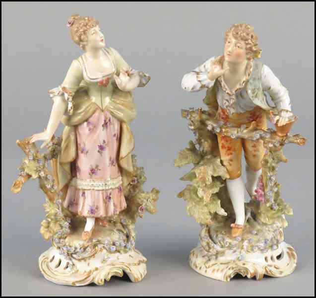 Appraisal: PAIR OF CONTINENTAL GILT AND PAINTED PORCELAIN FIGURES Depicting male