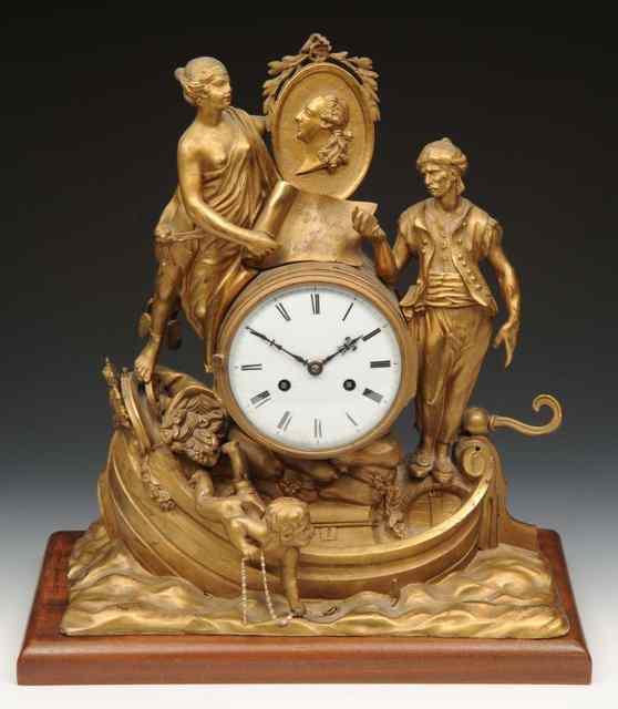 Appraisal: A CONTINENTAL CAST MANTEL CLOCK surmounted by figures in a