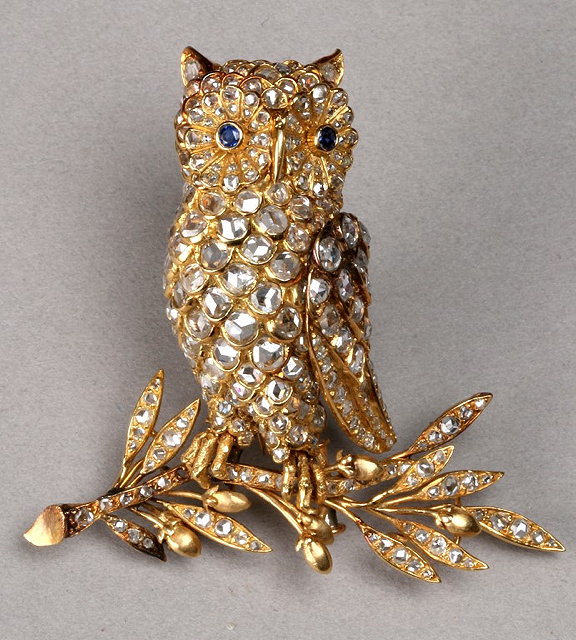 Appraisal: A DIAMOND SET OWL BROOCH perched on a branch with