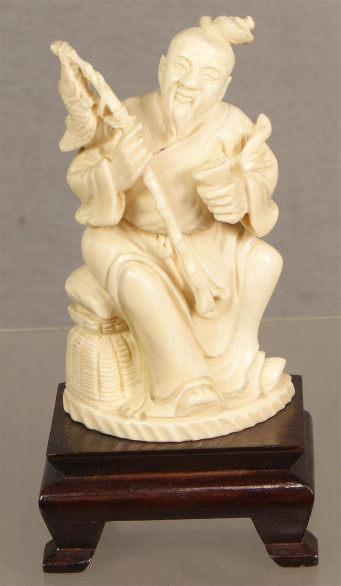 Appraisal: Carved ivory fisherman measures h th c Estimate -